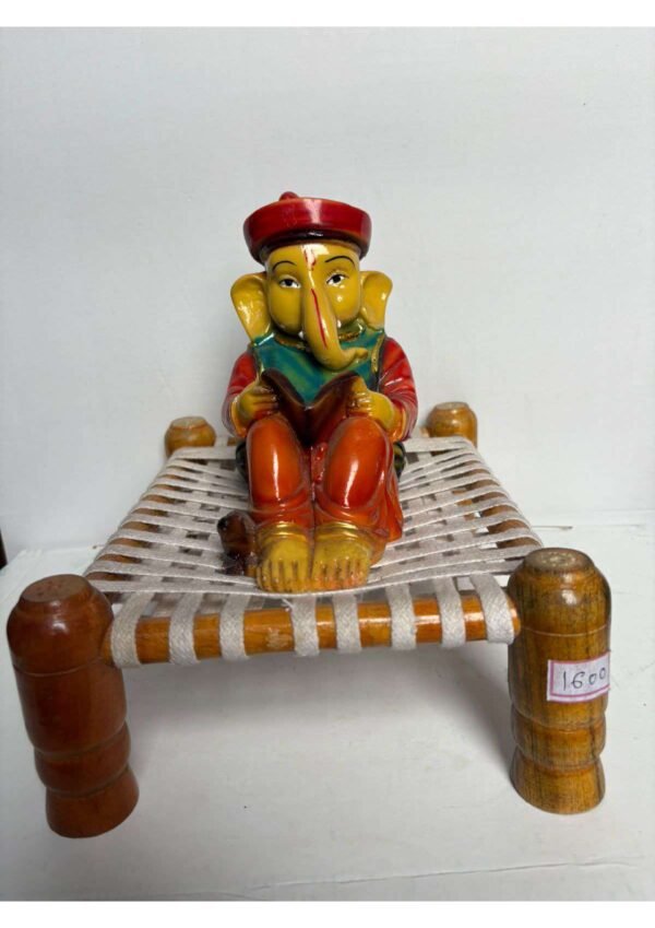 Lord Ganesha Reading Book on Traditional Charpai Statue